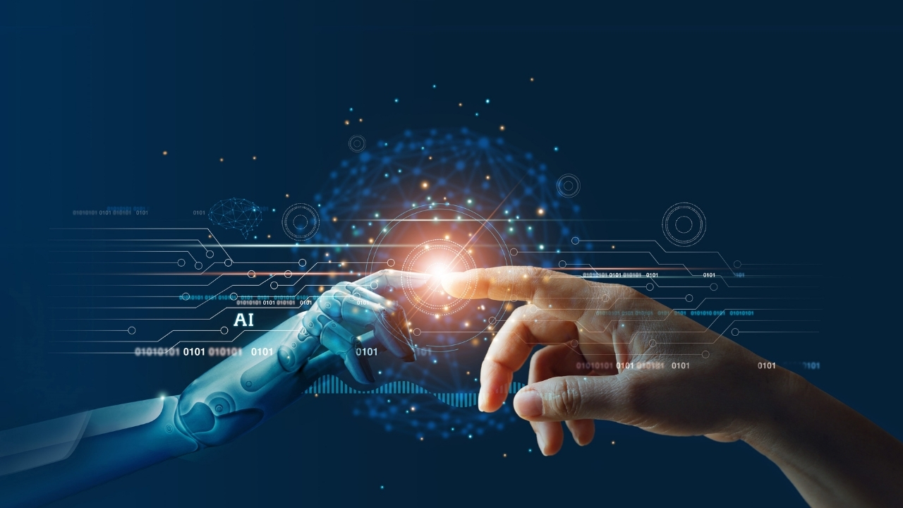 Eine Menschenhand und eine Roboterhand, die sich an mit dem Zeigefinger berühren.